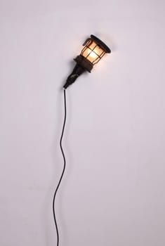 Old vintage light from the 70s, hanging on wall, isolated