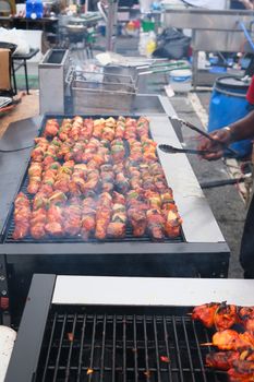 Grilling Chicken, Beef and Pork Kabobs at a Night Market