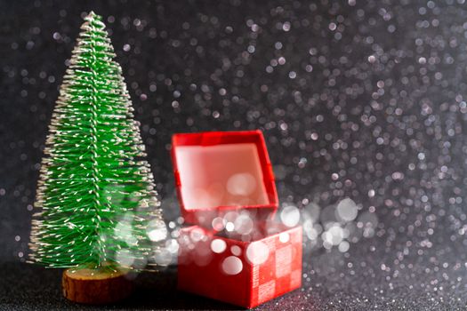 Christmas tree and gift box. Festive christmas background.