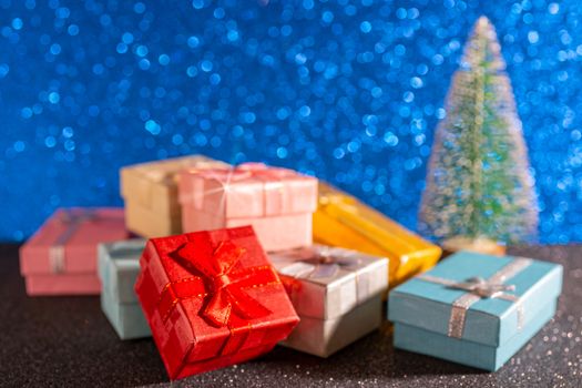 Christmas tree and gift box. Festive christmas background.