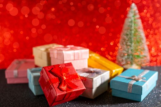 Christmas tree and gift box. Festive christmas background.