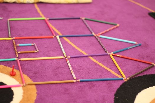 pencil color object on purple carpet