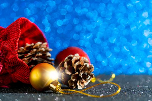 Christmas blue background. Red gift bag and Christmas toys.