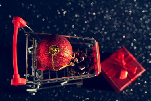 Christmas toys and gifts on a shiny dark background.