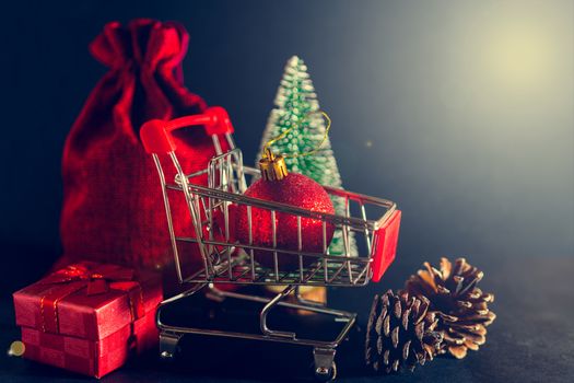 Christmas toys and gifts on a shiny dark background.
