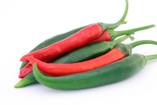 In images Different kinds of pepper on wooden background