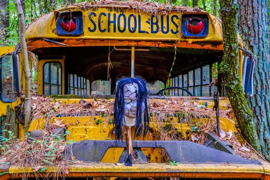 Horror Mask on School Bus in a Junkyard