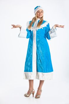 Young beautiful girl in a carnival clothing on a studio background