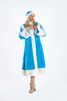 Young beautiful girl in a carnival clothing on a studio background