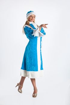 Young beautiful girl in a carnival clothing on a studio background
