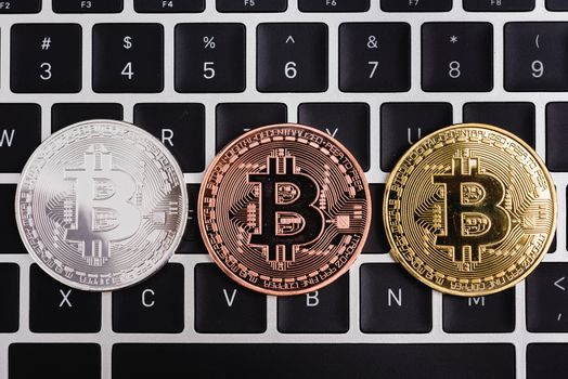 Coins bitcoin money currency financial on laptop keyboard