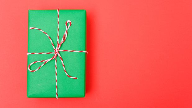 New Year, Christmas Xmas holiday composition, Top view green gift box on red background with copy space