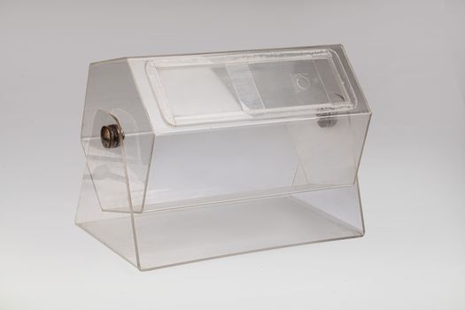 Transparent lottery drum on an isolated studio background