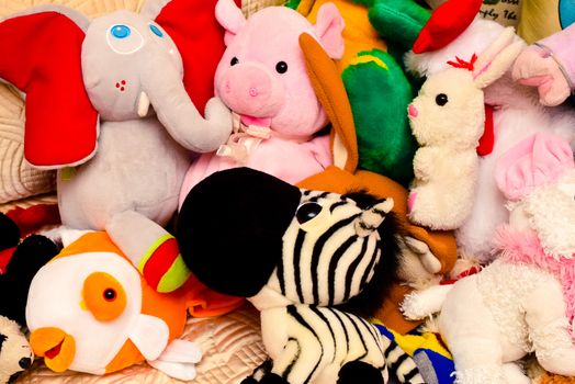 bright colored soft toys in a messy situation