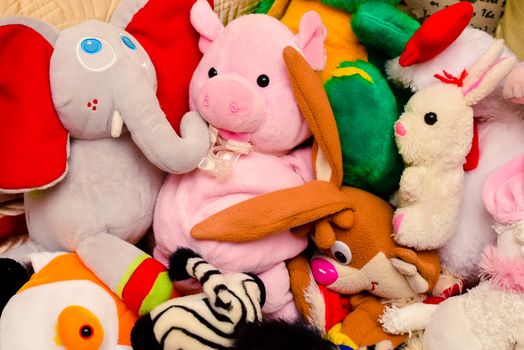 bright colored soft toys in a messy situation