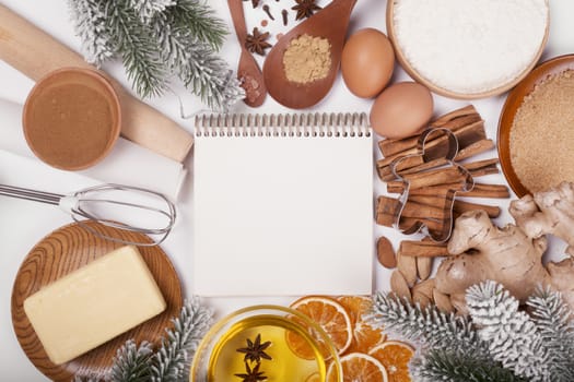 Christmas gingerbread cookies cooking background flat lay top view template with copy space for text. Baking utensils, spices and food ingredients