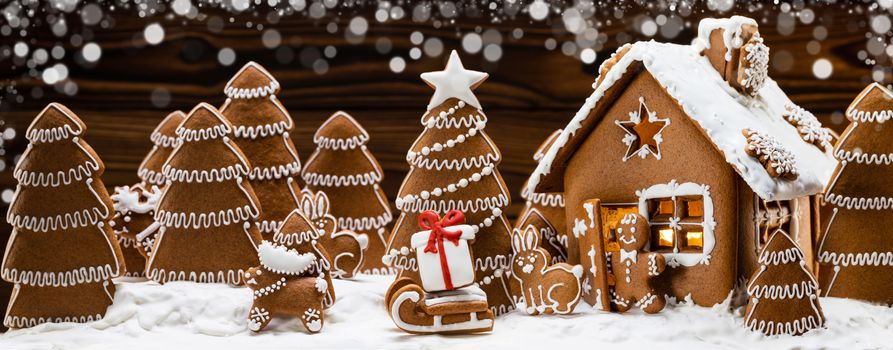 Gingerbread house christmas fir trees and gift cookies winter holiday celebration concept