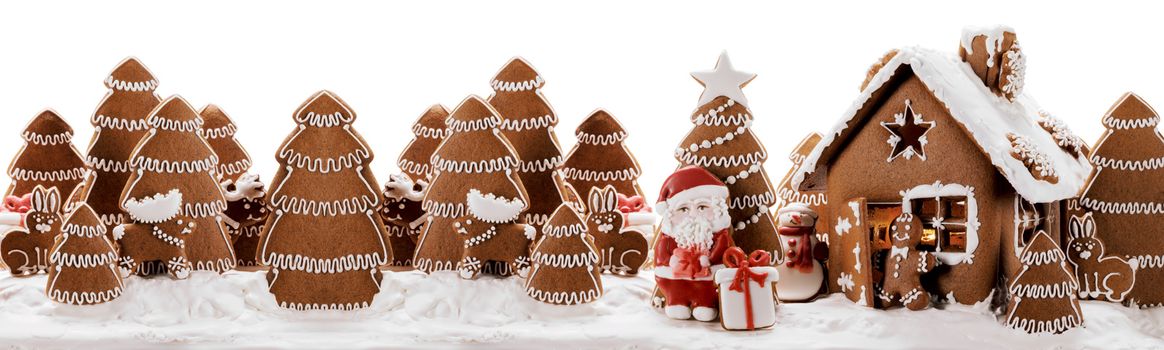 Gingerbread house christmas fir trees Santa Claus and gift cookies winter holiday celebration concept isolated on white background