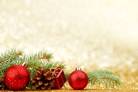Christmas card with fir and decor on glitter background