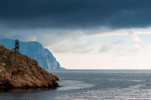 Black rain clouds over the sea, dramatic landscape on a cloudy day