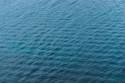 Ripples on the surface of blue water of the Black Sea top view of a natural background