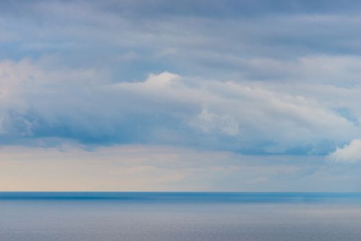 Clouds over the sea, background seascape before the rain