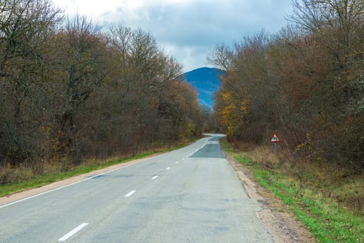 The road in the mountains with bends, landscape autumn day