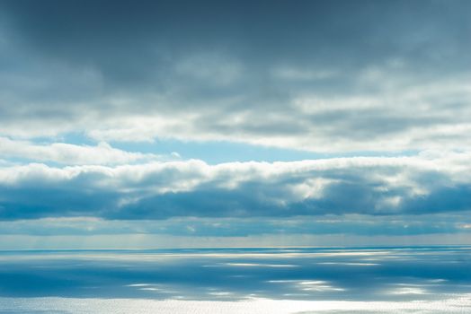 The majestic sky and sea, the view of the horizon and blue clouds over the water