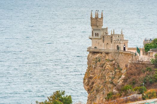 View of the landmark of Crimea - Swallow's Nest on the edge of a cliff against the background of the sea, Russia