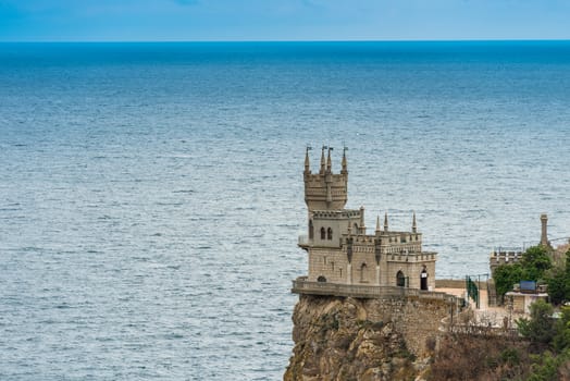 Swallow's Nest on the edge of a cliff against the background of the sea, view of the landmark of the Crimea - Russia