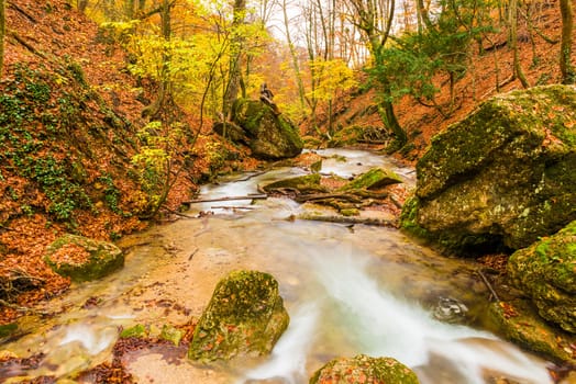 The picturesque river in the mountains in the autumn, the landscape of the Crimean peninsula, Russia in October