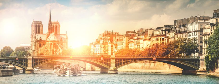 View of the city of Paris from the Seine at sunset