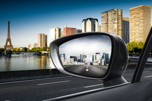 Paris view through a rearview mirror