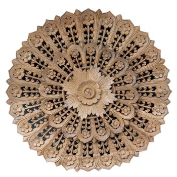 Wooden pattern of flower on carve teak wood in circle shape for decoration isolated on white blackground.