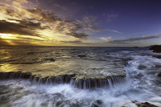 In images Scenic image of Iceland. Incredible Nature scenery during sunset. Great view on famous Mount Kirkjufell with Colorful, dramatic sky. popular plase for photografers. Best famous travel locations.