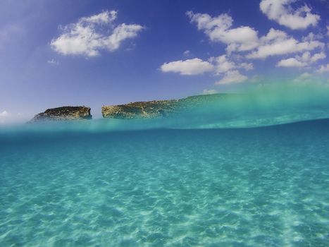 Half underwater photograph in the mediterranean sea near Malta, Comino, Blue Lagoon 2019