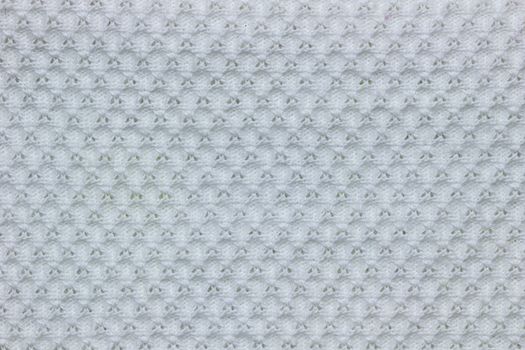 Texture of white shirt fabric. Concept of clothes or fashion.