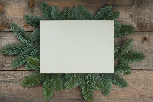 Christmas frame of natural fir tree branches with copy space for text