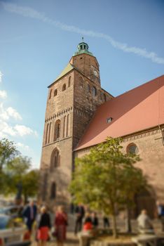 Church exterior during wedding ceremony. Blue sky with sunny weather