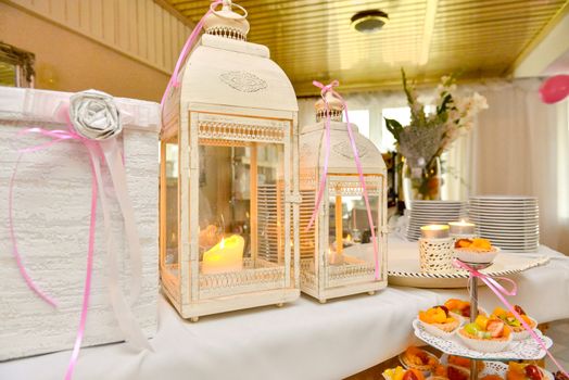 Delicious sweets on candy buffet. Wedding bakes on trays.