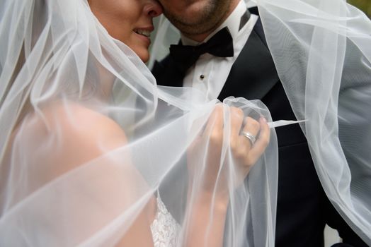Bride and groom at a photo session in the nature.
