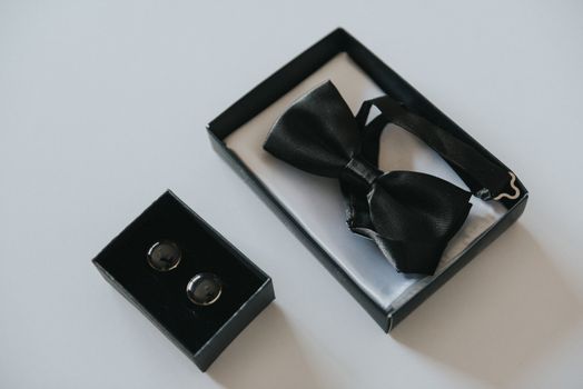 Groom's wedding accessories. Bow tie, suit, cufflinks, belt and shoes