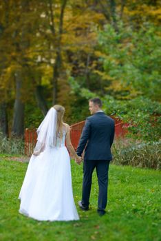Bride and groom at a photo session in the nature.