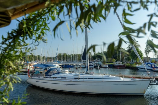 Pier speedboat. A marina lot. This is usually the most popular tourist attractions on the beach.Yacht and sailboat is moored at the quay