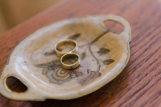 Beautiful two golden wedding rings. Made of highest quality material