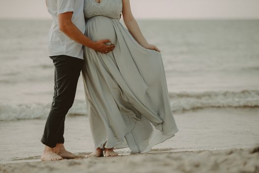 Bride and groom at a photo session in the nature. Baltic sea beach.