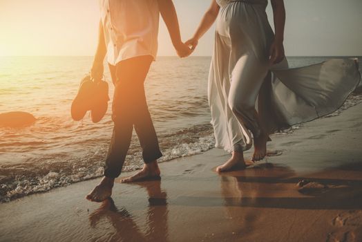 Bride and groom at a photo session in the nature. Baltic sea beach.