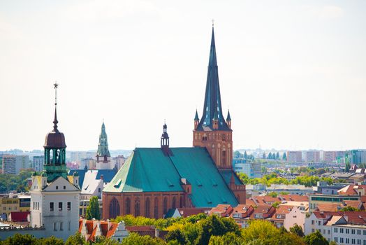 Cityscape with Odra river. Szczecin historical city with architectural layout similar to Paris. Castle of Pomeranian dukes in Szczecin and Basilica of Saint James