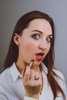Professional Make-up. Lipgloss. Red Lipstick applying