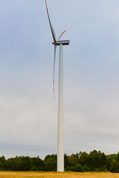 Windturbine. Eco power renewable energy production from wind. Windmill saves the earth's natural ingredients. Green ecology and pure electricity.